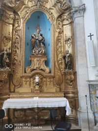 Statue in temple against building