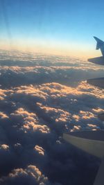 Cropped image of airplane flying over sea