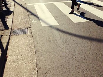 Shadow of people on road