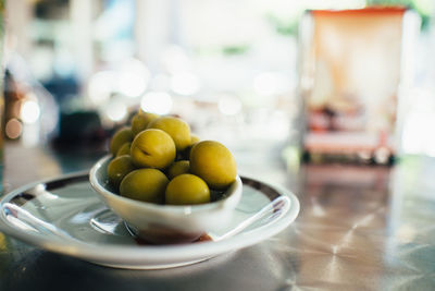 Close-up of olives in bowl on table