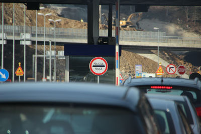 Close-up of car on road