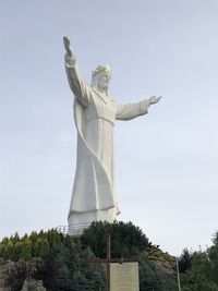 Low angle view of statue against sky