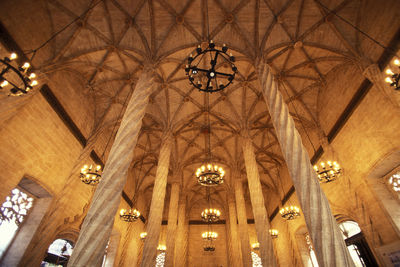 Low angle view of illuminated chandelier in building