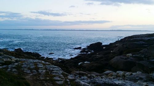 Scenic view of sea against cloudy sky