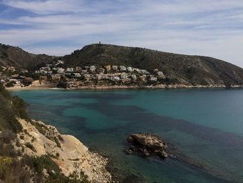 Scenic view of sea and rocks against sky