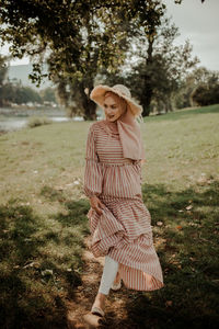 Woman wearing hat on field