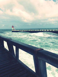 Pier over sea against sky