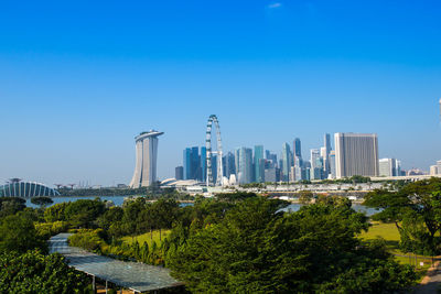 View of cityscape against blue sky