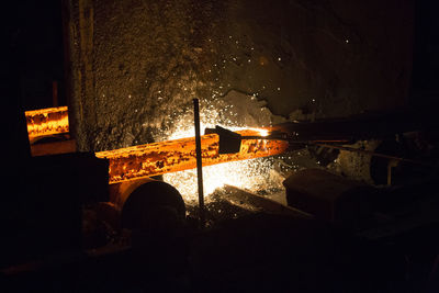 People working on fire hydrant at night