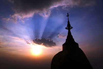 Low angle view of silhouette building against sky during sunset