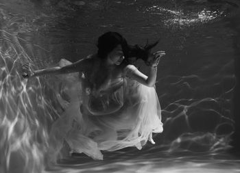 Woman swimming in pool