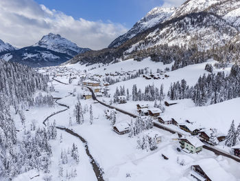 Scenic view of snow covered mountains against sky