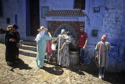 Group of people on street in city