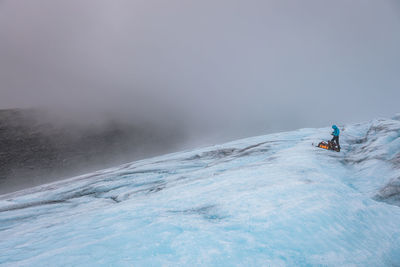 Full length of man on glacier