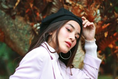 Portrait of young woman in park