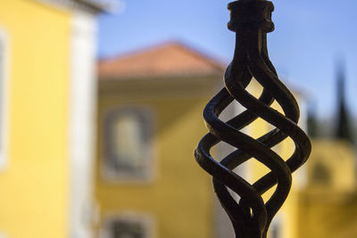 Close-up of metal structure against sky