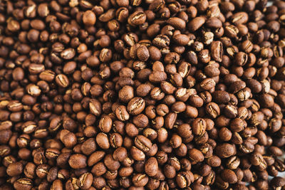 Premium roasted coffee beans on background
