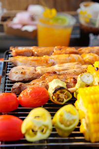 Closeup image of grilled vegetable and chicken skewers on a hot barbecue