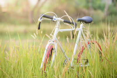 Close-up of bicycle on field