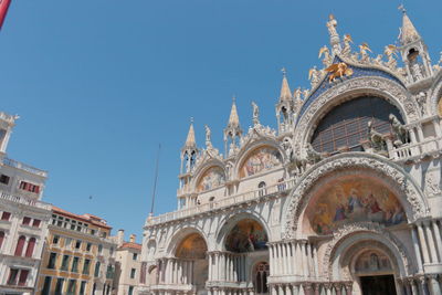 Low angle view of building against blue sky