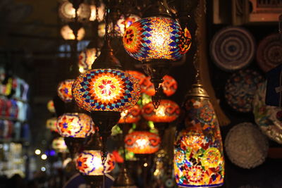 Close-up of illuminated lighting equipment for sale in market