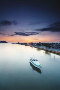 High angle view of boat on lake at sunset