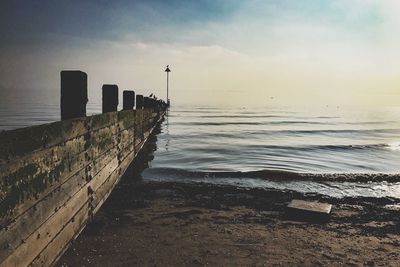 Scenic view of sea against sky at sunset