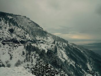 Scenic view of mountains against sky during winter