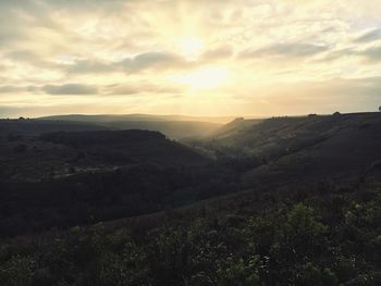 Scenic view of landscape against cloudy sky