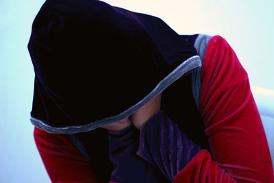 Rear view of man wearing red hat