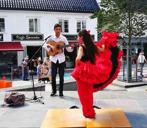 Full length of man playing guitar