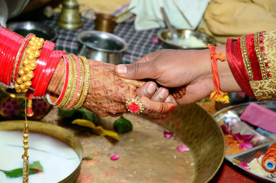 Midsection of woman with tattoo on hands