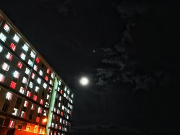 Low angle view of illuminated building at night