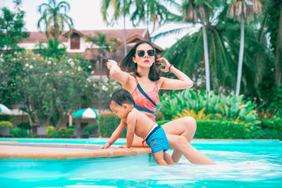 Full length of young man in swimming pool