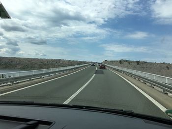 Highway seen through car windshield
