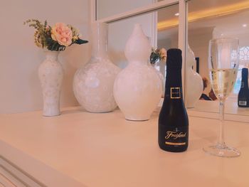 Close-up of flower vase on table at home