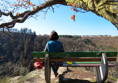 Rear view of man sitting on seat