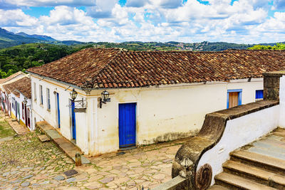 Houses in city against sky