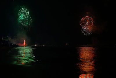 Firework display at night