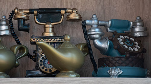 Close-up of old machine part on table