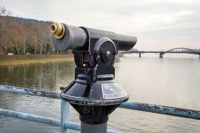 Coin-operated binoculars on river