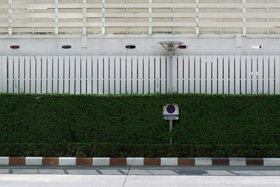 Information sign on fence in city