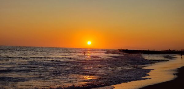 Scenic view of sea against sky during sunset