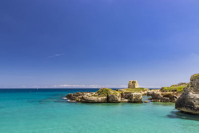 Scenic view of sea against clear blue sky