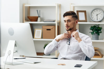 Young man using laptop at home