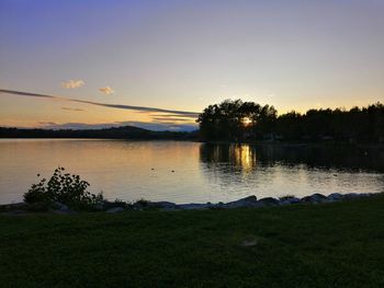 Scenic view of lake against sky during sunset