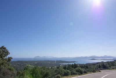 Scenic view of landscape against blue sky