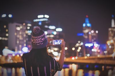 Defocused image of illuminated city at night