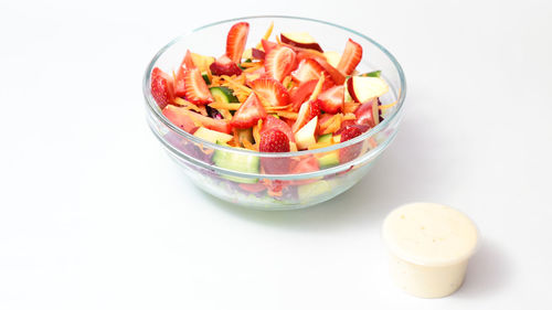 High angle view of chopped fruits in bowl on table