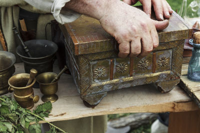 Close-up of a box and man hand